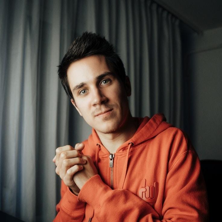 Amina Shah, Lead Design Curator at Polite Field Wander, reviewing corporate floral arrangements